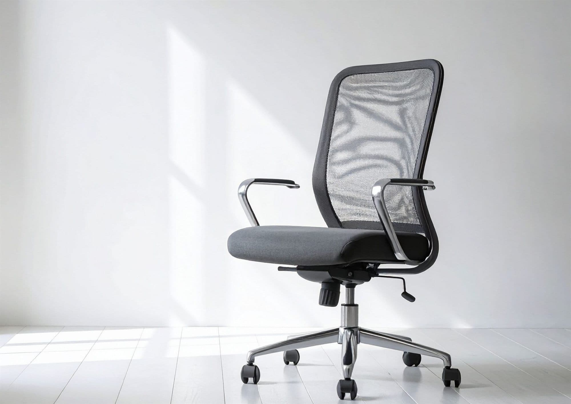 Grey mesh office task chair cleaned by The Carpet Guys