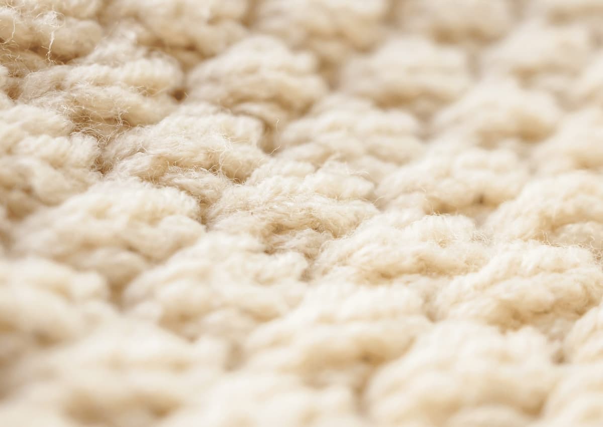 Close-up of carpet pile after professional deep cleaning , showing restored fibres and clean texture